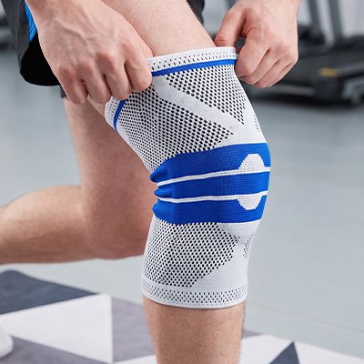 Genouillere pour le sport​ mains sur genouillère
